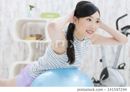 Women training with balance balls Women training with balance balls 141597294