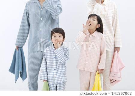A family yawning in their pajamas A family yawning in their pajamas 141597962