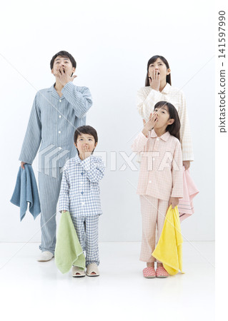 A family yawning in their pajamas 141597990