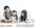 A family teaching in the living room 141598205