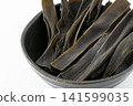 Close-up of kelp snacks in a small bowl 141599035