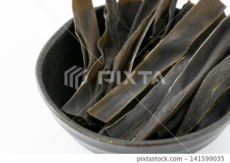 Close-up of kelp snacks in a small bowl Close-up of kelp snacks in a small bowl 141599035