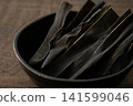 Close-up of kelp snacks in a small bowl 141599046