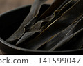 Close-up of kelp snacks in a small bowl 141599047