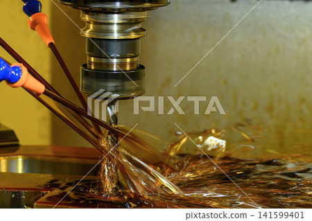 CNC milling machine performing hole drilling process using canned cycle with oil coolant fluid CNC milling machine performing hole drilling process using canned cycle with oil coolant fluid 141599401