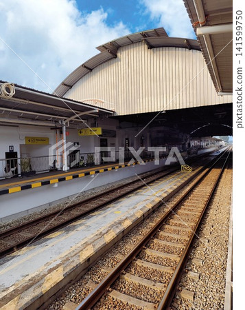 the train station is still empty of passengers the train station is still empty of passengers 141599750