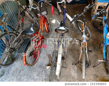 several bicycles are parked neatly several bicycles are parked neatly 141599803
