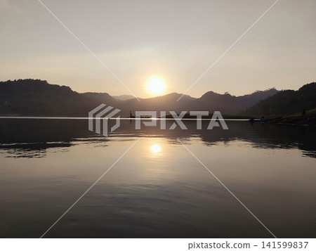 beautiful sunset over a lake in the mountains beautiful sunset over a lake in the mountains 141599837