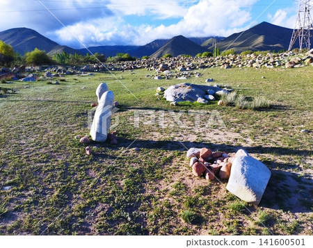 Grasslands and stone pillars of the Karakol region Grasslands and stone pillars of the Karakol region 141600501