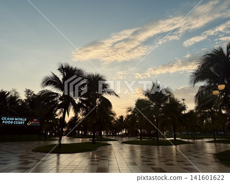 Sunset view of the seaside and palm trees at Grand World on Phu Quoc Island Sunset view of the seaside and palm trees at Grand World on Phu Quoc Island 141601622