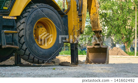 Suspended rear wheel on hydraulic stops of bulldozer 141602492