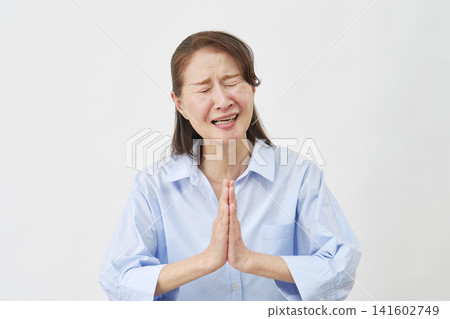 Elderly woman begging on white background Elderly woman begging on white background 141602749