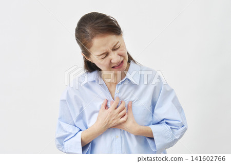 Senior woman, chest pain, white background Senior woman, chest pain, white background 141602766