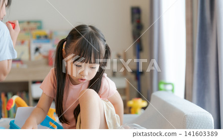 Girls playing in the room Girls playing in the room 141603389