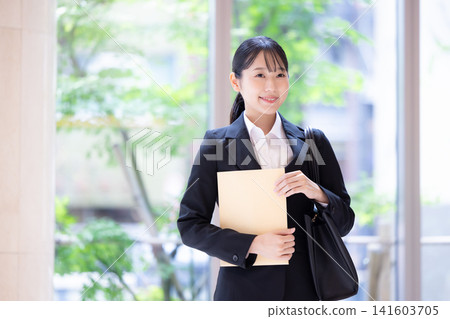 Job hunting: Portrait of a woman in a business suit. Photography cooperation: Denpa Gakuen Tokyo Electronics College. Job hunting: Portrait of a woman in a business suit. Photography cooperation: Denpa Gakuen Tokyo Electronics College. 141603705