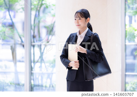 Job hunting: Portrait of a woman in a business suit. Photography cooperation: Denpa Gakuen Tokyo Electronics College. Job hunting: Portrait of a woman in a business suit. Photography cooperation: Denpa Gakuen Tokyo Electronics College. 141603707