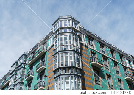 Old residential building facade in Santander, Spain, featuring balconies and dormer windows. Old residential building facade in Santander, Spain, featuring balconies and dormer windows. 141603788