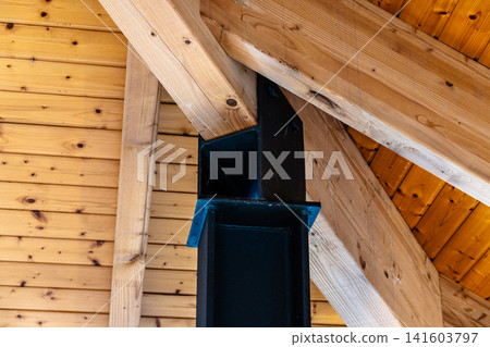 Wooden beams and a black metal support structure Wooden beams and a black metal support structure 141603797