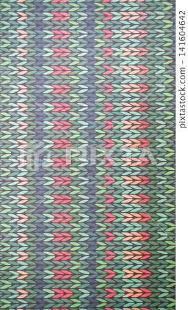 Vibrant geometric pattern with colorful zigzags in green, red, and blue Vibrant geometric pattern with colorful zigzags in green, red, and blue 141604642