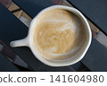 A cup of cappuccino with foam 141604980