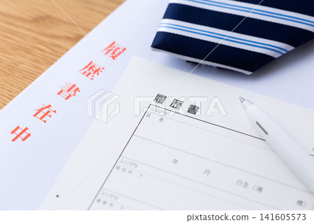Resume and blue regimental tie Resume and blue regimental tie 141605573