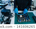 Close-up of semiconductor microchip on circuit board, motherboard processor for computer repair, hardware technology and chip manufacturing industry concept. 141606265