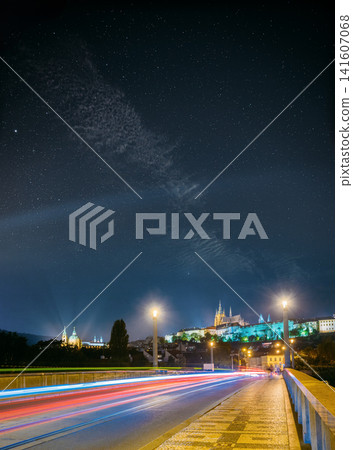 Traffic light trails on a bridge with Prague Castle at night Traffic light trails on a bridge with Prague Castle at night 141607068