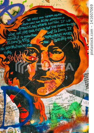Orange portrait graffiti detail on the John Lennon Wall Orange portrait graffiti detail on the John Lennon Wall 141607069