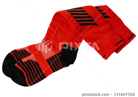 Pair of red athletic knee-high socks isolated on white background. Padded sport compression socks for skiing Pair of red athletic knee-high socks isolated on white background. Padded sport compression socks for skiing 141607588