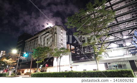 A full moon hangs in the night sky over Yu Town Sogawa and Onsen Ryokan Nono in the middle of the night (Toyama City, 16:9) A full moon hangs in the night sky over Yu Town Sogawa and Onsen Ryokan Nono in the middle of the night (Toyama City, 16:9) 141609292