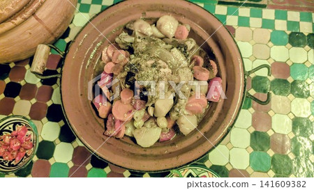 Freshly Served Traditional Moroccan Chicken Tagine with Root Vegetables Freshly Served Traditional Moroccan Chicken Tagine with Root Vegetables 141609382