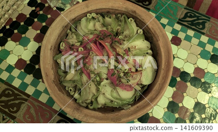 Traditional Moroccan Vegetable Tagine with Chili Peppers in Clay Pot Traditional Moroccan Vegetable Tagine with Chili Peppers in Clay Pot 141609390