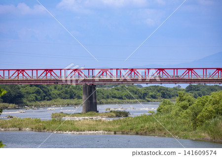The red Eso-shuku Bridge over the Chikugo River in Fukuoka Prefecture The red Eso-shuku Bridge over the Chikugo River in Fukuoka Prefecture 141609574