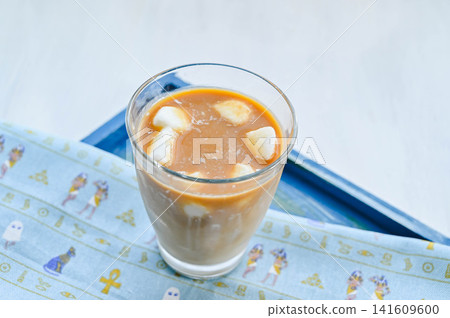 Iced café au lait with homemade milk ice. Iced café au lait with homemade milk ice. 141609600