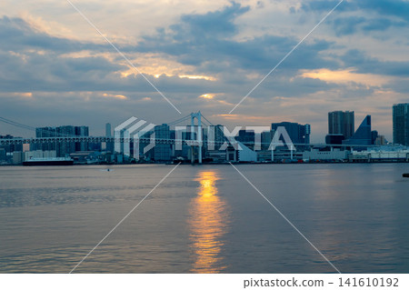 The cityscape of Tokyo Bay and the Rainbow Bridge at dusk The cityscape of Tokyo Bay and the Rainbow Bridge at dusk 141610192
