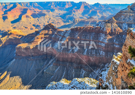 On a clear winter morning, from Mather Point in Grand Canyon National Park, the canyon is bathed in the morning sun, creating a breathtaking, three-dimensional view. On a clear winter morning, from Mather Point in Grand Canyon National Park, the canyon is bathed in the morning sun, creating a breathtaking, three-dimensional view. 141610890