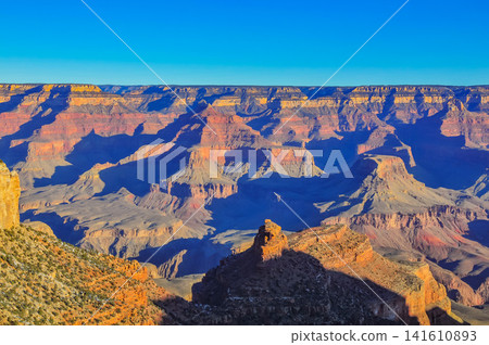 On a clear winter morning, from Mather Point in Grand Canyon National Park, the canyon is bathed in the morning sun, creating a breathtaking, three-dimensional view. On a clear winter morning, from Mather Point in Grand Canyon National Park, the canyon is bathed in the morning sun, creating a breathtaking, three-dimensional view. 141610893