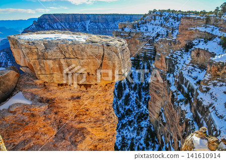 On a clear winter morning, from Mather Point in Grand Canyon National Park, the canyon is bathed in the morning sun, creating a breathtaking, three-dimensional view. 141610914