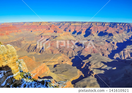 On a clear winter morning, from Mather Point in Grand Canyon National Park, the canyon is bathed in the morning sun, creating a breathtaking, three-dimensional view. On a clear winter morning, from Mather Point in Grand Canyon National Park, the canyon is bathed in the morning sun, creating a breathtaking, three-dimensional view. 141610921