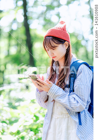 A young woman climbing A young woman climbing 141610988