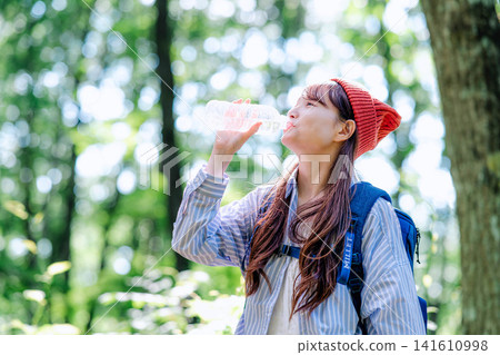 A young woman climbing A young woman climbing 141610998