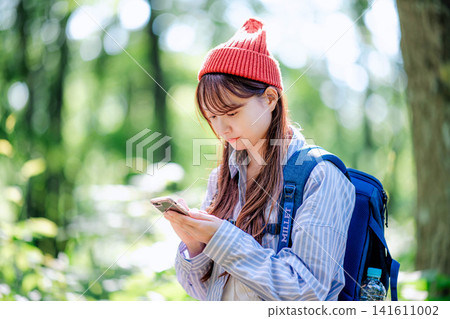 A young woman climbing A young woman climbing 141611002