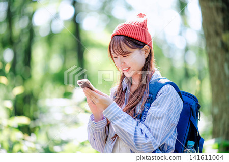 A young woman climbing 141611004