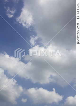 It is a blue sky with fluffy clouds. 141611176
