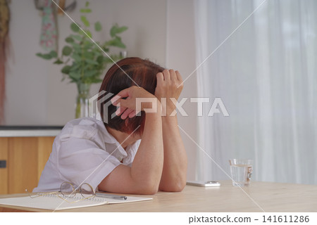 Senior women suffering from menopausal symptoms and poor health Senior women suffering from menopausal symptoms and poor health 141611286
