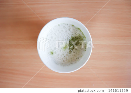 green tea or matcha green tea, milk green tea or matcha latte or matcha green tea latte in the paper glass green tea or matcha green tea, milk green tea or matcha latte or matcha green tea latte in the paper glass 141611339