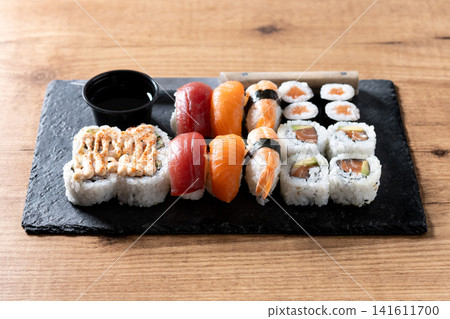 Assorted sushi platter with salmon, tuna, shrimp nigiri and sushi rolls Assorted sushi platter with salmon, tuna, shrimp nigiri and sushi rolls 141611700