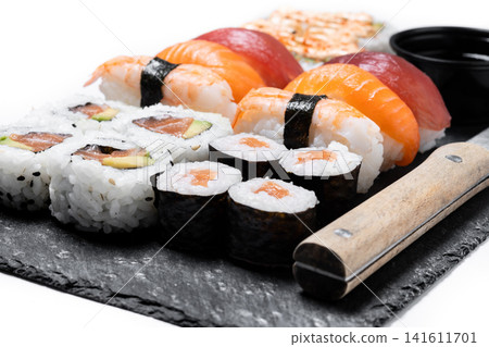 Assorted sushi platter with nigiri, maki and uramaki Assorted sushi platter with nigiri, maki and uramaki 141611701