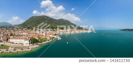 Drone panorama of Salo waterfront, harbor and Mount San Bartolomeo on Lake Garda Drone panorama of Salo waterfront, harbor and Mount San Bartolomeo on Lake Garda 141611730