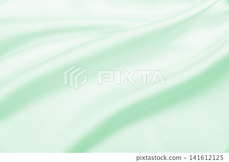 Smooth elegant green silk or satin luxury cloth texture as abstract background. Luxurious background design Smooth elegant green silk or satin luxury cloth texture as abstract background. Luxurious background design 141612125